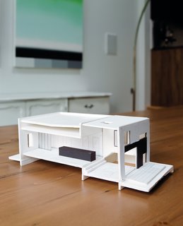 As shown on the model, the architect traded the brick on the rear facade for steel, wood, and an Alumilex door leading to the family’s new backyard; he retained the brick at the entrance.