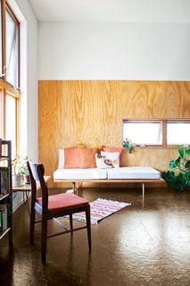 A peek into two rental units reveals simple but strong interiors. The architects clad the walls with polyurethane-coated plywood "to provide a durable and attractive finish and provide visual separation between the two levels in the high volume," says Shelton.