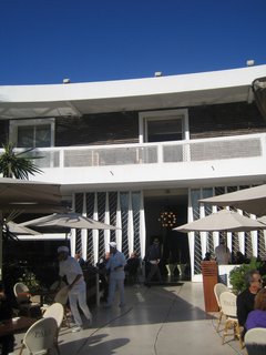 Waiters raced in and out of the restaurant. The looked so efficient and official in their white uniforms.