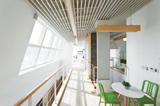 Windows UpdateBy angling the second-story window away from the hall, Unsangdong created an expansive space without adding to the house’s footprint. A building-integrated photovoltaic window by Kolon does double duty bringing both light and energy into the house.