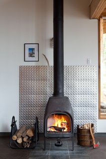 The structures share a solar panel, but the families control their own home's heat level with a wood-burning stove.
