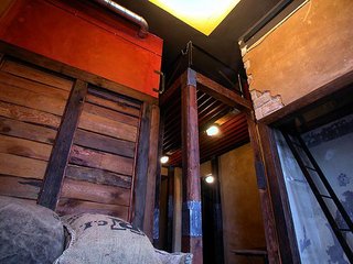 Built out of the original rafters of the hotel, Larchenson modeled this room after a barn. Lounge on potato sacks filled with foam rubber and climb up the hidden ladder to your bed.
