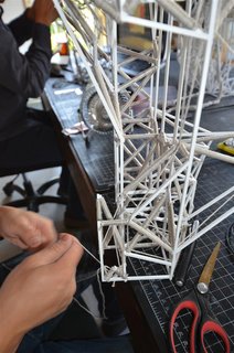 Here’s a close-up showing the frame being "pre-looped" with yarn.