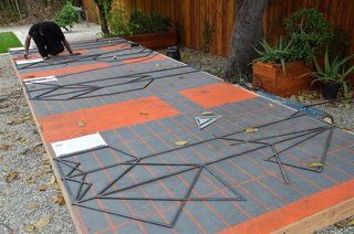 Once all the pieces are cut correctly and laid out on the grid, they are ready to be welded.