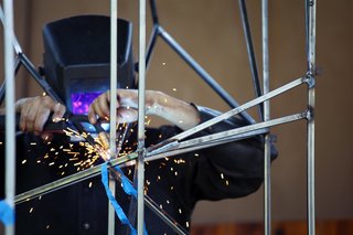 Welding precise connections. Photo by Teri Yu.