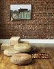 In the office, a vintage brass gooseneck floor lamp positioned above woven
jute cushions creates the perfect perch
for Mandayam’s backgammon hobby.
The painting—Wall, from 2002—is by
Nicholas Evans-Cato, a professor at RISD. Photo of Examples of Rustic Modern Done Right modern home