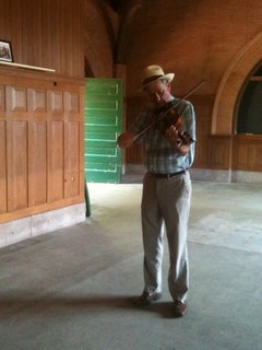Kirk Brandenberger plays the fiddle in the Keokuk Union Depot.