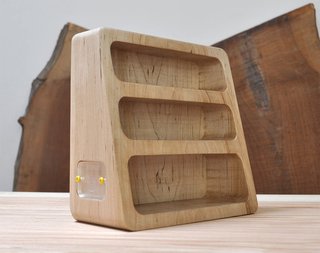 Bushakan's eyewear stand is carved from solid ash.