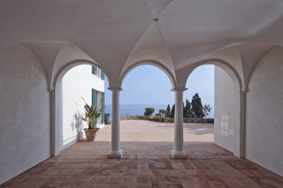 A Renovated Modernist Oasis in the French Riviera - Photo 2 of 9 - The remodel involved restoring the concrete ceilings, parapets, terrace stairs, and pergolas, down to each vault, arch, and corbel. The grandiose Baroque balustrades had to be replaced by filigree post banisters.