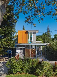 Movable wood screens on the exterior provide shade to alleviate heat gain. The home is color coded to correspond to the outside elements.