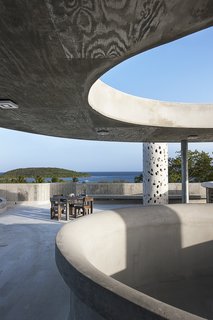 El Blok, a 22-room hotel in Vieques, Puerto Rico, strikes a unique profile. Its meandering shape features numerous cut-outs that let light in, casting playful shadows. The LEED Gold-certified property, designed by San Juan-based firm Fuster + Architects, shows the texture of the plywood boards that were used to create the building's framework.