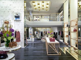 This view from the mezzanine shows all three stories of the boutique. The retail area takes up two floors while the third is a gallery-art space.