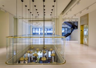 This view from the gallery shows the ceiling fixtures and highlights the boutique's minimalist feel.
