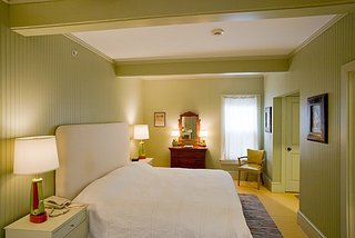 Porches Inn, North Adams, Massachusetts - Photo 8 of 21 - Painted bureaus and bedside tables made in Vermont mix with an eclectic assortment of vintage furniture. Though it varies room to room, artwork is predominately paint-by-number style from the 1950s and 1960s.