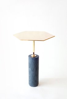 The Hawley side table ($1,850) has a hexagonal solid brass top and a base made from pietra cardosa marble. Use solo or group a fleet together to form a honeycomb-like coffee table.