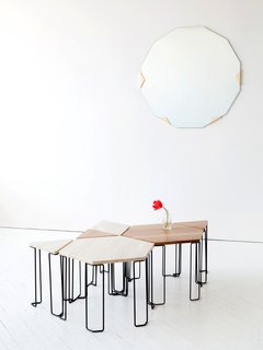 The Bradford table plays to the theme of individual pieces that can be grouped as a whole. Prices range from $610 for the triangular wood-topped table to $1,290 for the stone hexagon; the bases are blackened steel.