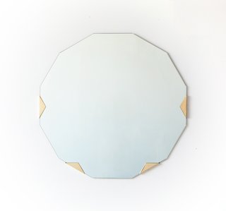 The 12-sided Haynes mirror ($2,800) slips into solid brass or nickel-plated brass brackets. "Many of our designs are made with materials that will patina over time," says Ellis. "For example we intentionally don't laquer our brass pieces so that they will age as they are used. We think this speaks to the lifespan of our objects."
