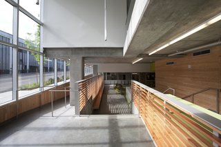 Ground level floor-to-ceiling windows extend the length of the west façade. Photo by Sally Schoolmaster.