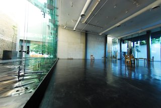 Hotel Demetria, Guadalajara - Photo 4 of 7 - The glass walls were chosen to connect the hotel with Casa Quiñones and Casa Franco. On either side of the hotel, you can see the exterior wall of the adjacent house.