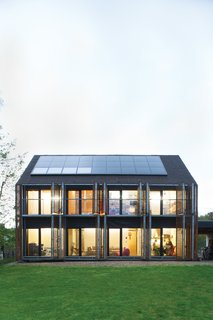 Passive Progressive - Photo 2 of 8 - Sun Volt<br><br>With the roof angled at 43 degrees, the architects lined the southern slant of the house with solar panels to collect as many rays as possible. Karanesheva and Witzmann started with four, but then added 23 more, all by Systaïc; the company gave them a deal since theirs was its first installation in France. The panels now collect far more energy than the home actually needs, a precious resource that the pair sells back to the power company.<br><br>systaic.com