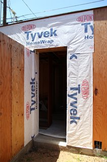 Dwell Home Venice: Part 14 - Photo 1 of 9 - Dupont Tyvek weather barrier covers the wall near a doorway. Tyvek flashing will be added prior to the door installation.