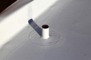 Dwell Home Venice: Part 14 - Photo 7 of 9 - An example of a vent penetrating the roof surface. The penetration is sealed so no water can leak into the house. These important details are often invisible to most occupants of buildings.