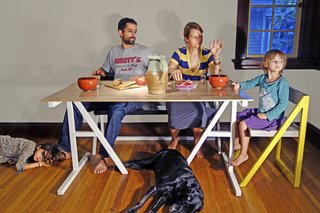 Mark Moskovitz and his family dine at the table he designed.
