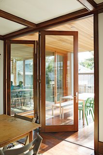 Easy Transitions<br><br>To visually connect the kitchen with the outdoor covered patio, the architects installed a cedar ceiling that flows from interior to exterior, peppered with an uninterrupted grid of Iside 2 puck lights from Leucos USA. Bifold accordion doors by Sierra Pacific open all the way, allowing the Zuckermans’ large dinner parties to spill outside.<br><br>leucosusa.com<br><br>sierrapacificwindows.com