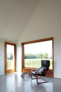 A Sustainably Built Home in Rural Ontario - Photo 12 of 16 - Though the house is only 925 square feet, Moffitt argues that it feels much larger, for which she credits three factors: its visual connections to the outdoors, its open spaces, and its simple interior-design language.