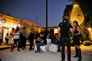 Dwell Party Highlights: Celebrating Prefab Design at SXSW Eco - Photo 4 of 20 - As the doors opened and night fell, the crowd began to grow. Some noshed on vegan local food truck fare while others headed for the prefab walkthrough.
