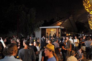 Dwell Party Highlights: Celebrating Prefab Design at SXSW Eco - Photo 9 of 20 - The rear prefab (completed the day of the event) is perched in front of a large geometric cabana structure which housed the margarita bar.