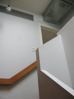 City Modern Home Tours: Brooklyn - Photo 48 of 51 - Lines of the staircase and railing play with one another in a visually pleasing way, and the exposed air ducts work with the comfortable, no nonsense design. "You don't notice the ducts by being frank about them," Bischoff says of the visible conduit.