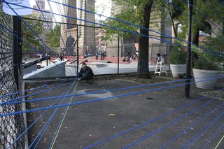 Volunteers install the pop-up exhibition. Architecture for Humanity hopes to find a permanent solution to the underutilized space.
