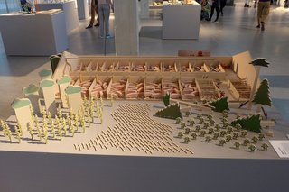 Tom Verthuis's "Playing Food" is a provocative take on the traditional wooden animal toys children to play with; the piece depicts the reality of farming practices and shows how meat is produced.