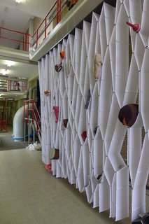 Amsterdam-based designer Elise Oussoren's "Elast-ic" storage system is made from wide elastic straps sewn together to hold objects in its individual pockets.