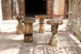 These brass-plated, cold-rolled, hollow-steel chess stools are multi-functional, serving as stool or table. Their geometric shape offers a versatile look appropriate for a variety of styles. Photo by Don Freeman.