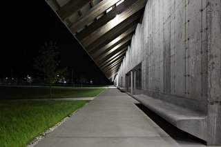 In creating this place for visitors to rest and take in the lush landscape, Herzog & de Meuron's lead architect Ascan Mergenthaler says the built-in benches put the concrete walls on a more "human scale" without interrupting the streamlined façade.