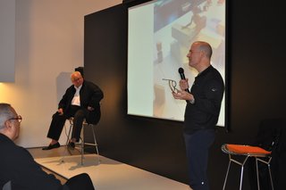 Nasir Kassamali: Design Lives - Photo 2 of 2 - Benjamin Pardo and Jeffrey Osborne talk onstage while Nasir Kassamali listens from the the first row.