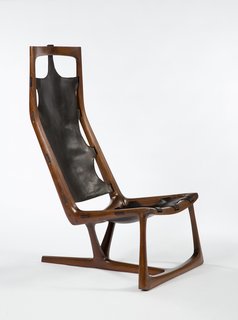 Early "Kangaroo" Chair, 1962. Walnut and leather. By Wendell Castle.