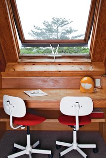 There is a small workstation on the upper level of the house.