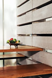 Elsewhere, the blocks accommodate other uses, like support for a built-in table and benches in the kitchen and a rooftop observatory (next slide) for watching the sun set over the Ilaló volcano.