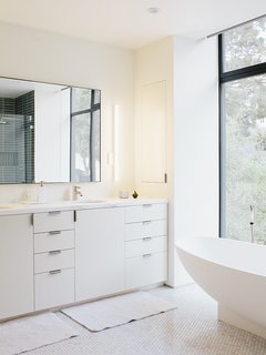 Heath Ceramics tile continues in the master bathroom.