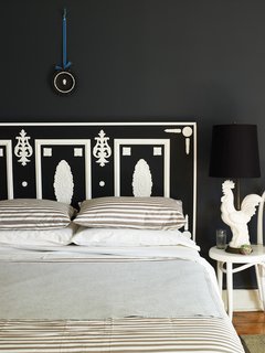 With a nod to 1700s designer Josiah Wedgwood’s jasperware pottery, this headboard designed by Eddie Ross is constructed with various moldings and a door. "It’s literal but he made it much larger and grander," says Azzarito of the striking and unusual headboard. Fun fact: Josiah Wedgwood’s daughter was married to Charles Darwin.