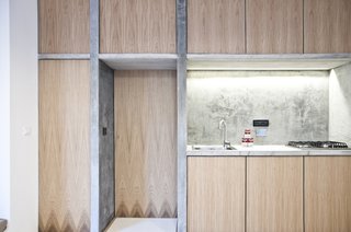 Despite the cast-on-site concrete dividers, there's still an airy sense of space; the dividers support, instead of overwhelm. This approach came from the architects' constant sense of experimentation and playfulness, a deliberate approach that helped them find new ways to use recycled and salvaged materials.