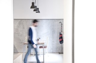 While the aesthetic was meant to convey a blank slate, historical touches abound inside. Pipes were restored from Gian Nicola Ricci's father's plumbing company, industrial lights from an old second-hand store found a new life, and outside of a few IKEA pieces, the furniture was all custom-built, mostly from salvaged material.