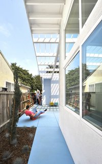 Vibrant Affordable Housing Prototypes in Los Angeles - Photo 7 of 11 - "The sites were extremely constrained; a circumstance we really welcomed," Lehrer says. "While some streets were in better shape than others, the basic urban housing fabric is intact. Our work is precisely to respect the existing fabric, understanding typology and what makes the streets coherent. Just blending in seamlessly would neither honor nor energize the street. It required some invention, palpable freshness and optimism." The 99th Street house is shown here.
