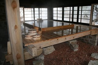 Japanese Soaking Tubs - Photo 3 of 13 - Deep in the Italian countryside a few hours from Rome, a fashion advertising couple left their frenetic life in Milan and remodeled a trio of 15-century buildings into a Japanese-style inn and center for Japanese culture. Their giant Hinoki tub from Bartok Design in Japan was carefully positioned to take advantage of seasonal views through the sliding windows. "The images and scents were extraordinary," said one Italian visitor to the center who took a soak, "I revisit them in my mind every day." Photo courtesy of: Bartok Design and WabiSabi Culture Japanese Center