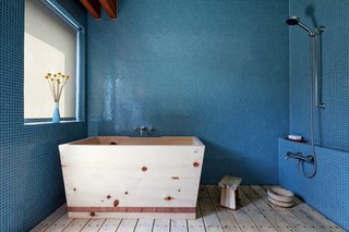 Japanese Soaking Tubs - Photo 4 of 13 - Japanese showers are usually set low down so the bather can sit on a stool and scrub, then pour cedar buckets of hot water over their heads for a refreshing rinse. This homeowner in Venice, California mounted a handheld shower head on the wall for added flexibility. The drain is under the removable cedar floor slats, keeping the room design uncluttered. Wood tubs are cleaned with a simple rinse and last for decades, as the antiseptic properties of cedar guard against mold and rot.<br>This ofuro was designed by Santiago Ortiz and fabricated by Bartok Design.