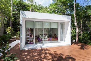 This Modern Miami House Feels Like It's in the Middle of the Jungle - Photo 11 of 12 - The structure is surrounded by a large deck for play.