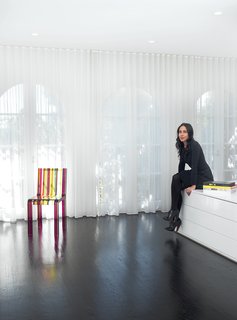 A Traditional Home and an Impeccable Eye - Photo 3 of 8 - Architect Abigail Turin added a dose of color to her black-and-white bedroom with a Rainbow chair by Patrick Norguet for Cappellini.